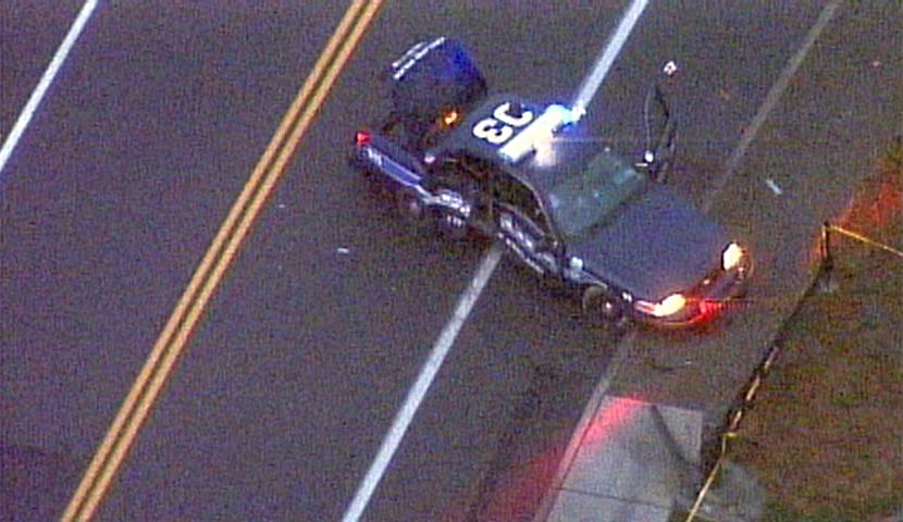 Kirkland Cop Headshots Upper Passenger-Side Windshield of Cruiser