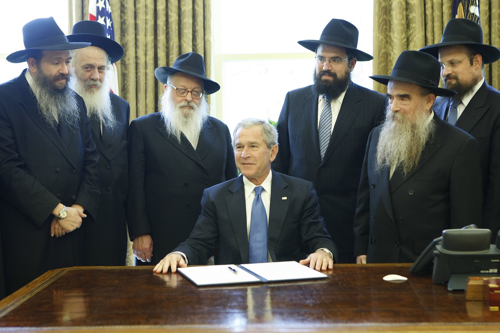President Bush, accompanied by Chabad Rabbis, is seen in the Oval Office of the White House in Washington, Tuesday, April 15, 2008, after signing the Honor of Education and Sharing Day Proclamation. (AP Photo/Gerald Herbert)